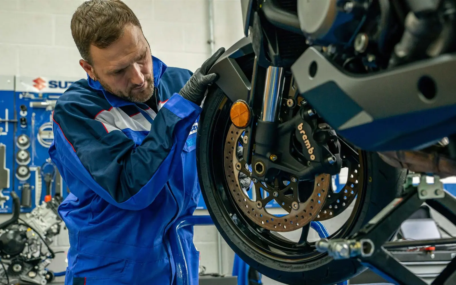 A motorcycle tyre being fitted in a professional workshop